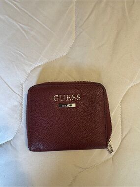 GUESS Burgundy Pebbled Zip Wallet with Gold Logo